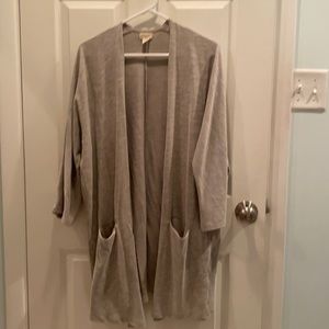 A cream/light green subtly striped cardigan